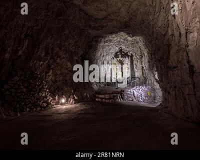 The image is of the main chapel at the medieval underground city museum of La Cite Souterraine de Naours in the French village of Naours. Stock Photo