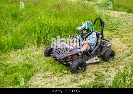 Electric powered Go-Kart racing around a field, High Bickington, North Devon, England, United Kingdom. Stock Photo