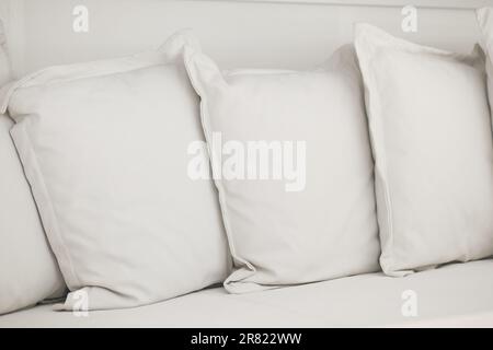 white pillow lined up on bed  Stock Photo