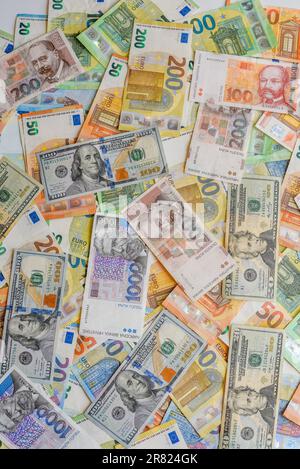 A variety of international currency arranged on a table in a decorative manner Stock Photo