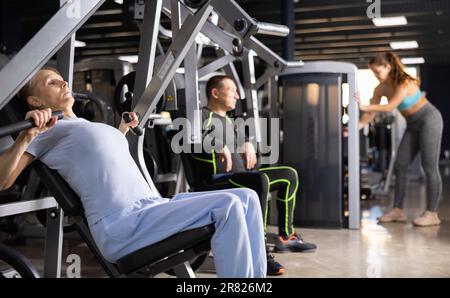 Female Athlete Exercising with Chest Press Machine in Fitness Studio Stock  Image - Image of goal, adult: 154105919