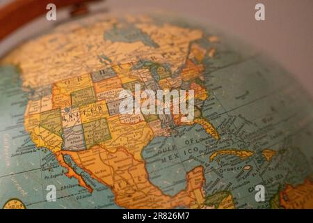 A high-resolution photograph of a detailed, close-up view of a globe, showing the United States in the center Stock Photo