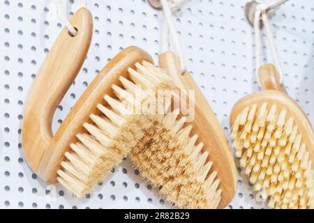 kitchen brushes hang in supermarket Stock Photo