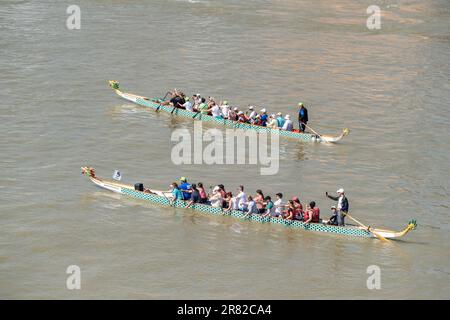 Budapest, Hungary – May 21, 2023. Two dragon boats with people on River Danube in Budapest, Hungary. Stock Photo