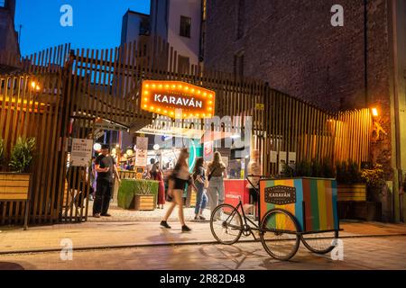 Budapest, Hungary – May 21, 2023. Karavan street food market in Budapest, Hungary. Located at Kazinczy utca 18 in Erzsebetvaros, this is a food court Stock Photo