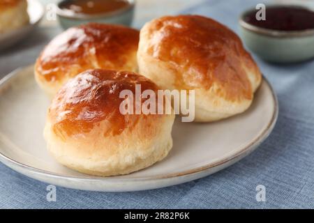 Tasty scones prepared on soda water on table, closeup Stock Photo