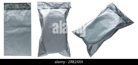 Grey and blank plastic postal mailing bags parcel envelope self seal courier pouches shipping postal packing isolated on white background. Stock Photo