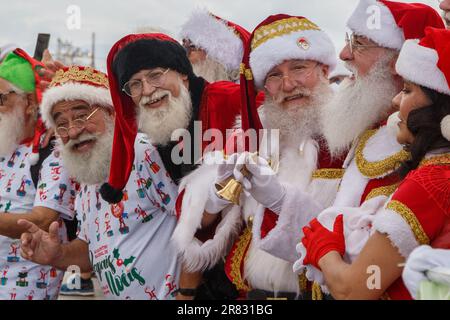 Rio De Janeiro, Brazil. 18th June, 2023. People dressed in Santa Claus costumes celebrate during the 4th Santa Claus National Encounter at Pier Maua in Rio de Janeiro, Brazil, June 18, 2023. Credit: Claudia Martini/Xinhua/Alamy Live News Stock Photo