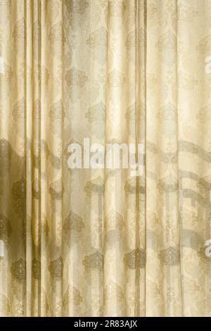 The sunlight is shining on the curtains. Stock Photo