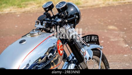 Close up of a classic and vintage BSA cafe racer motorcycle parked up on the promenade in the seaside town of Hunstanton on the North Norfolk coast Stock Photo