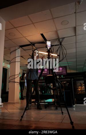Internet fraud, anonymous recording video, asking money for ransom, anonymous threatening on smartphone camera, stealing banking information. Cybercrime, online scam, hacker calling victim Stock Photo