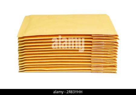 Close-up of yellow padded mailers stacked on a white background. Stock Photo