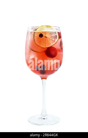 A tall glass of a refreshing raspberry cocktail, garnished with a lemon slice and full of healthy produce. Stock Photo