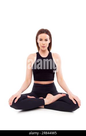 Woman doing lotus seat yoga pose, padmasana, isolated on white Stock Photo