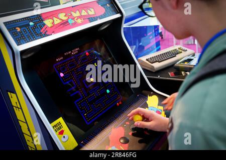 Rimini, Italy - June 15, 2023 :  An game room with the historic Pac-man arcade console Stock Photo