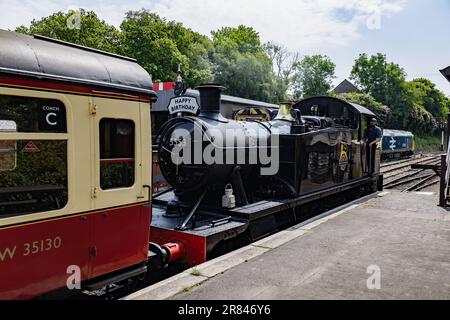 Bodmin, Cornwall, UK - June 13. Steam train at Bodmin General railway station in Bodmin, Cornwall on June 13, 2023. one unidentified man Stock Photo