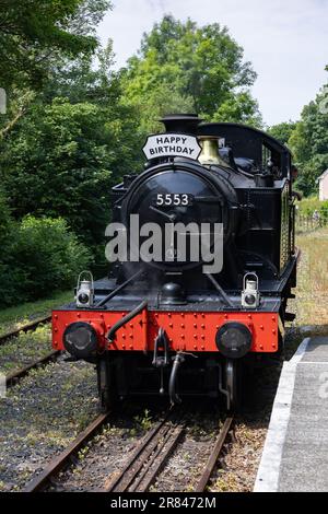 Bodmin, Cornwall, UK - June 13. Steam train at Bodmin General railway station in Bodmin, Cornwall on June 13, 2023. One unidentified man Stock Photo
