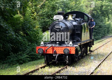 Boscarne, Cornwall, UK - June 13. Steam train at Boscarne junction in Bodmin, Cornwall on June 13, 2023. One unidentified man Stock Photo