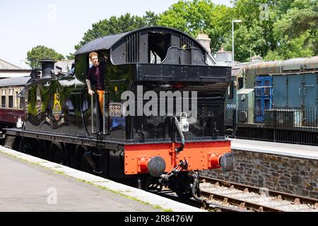 Bodmin, Cornwall, UK - June 13. Steam train at Bodmin General railway station in Bodmin, Cornwall on June 13, 2023. One unidentified man Stock Photo