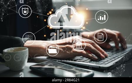 Virtual screen with cloud computing diagram displayed by a man Stock Photo