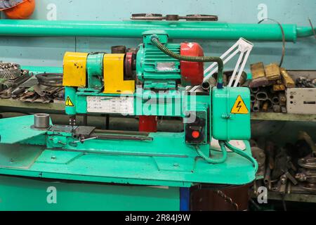 Metallic iron industrial centrifugal centrifugal pump in a metal workshop on the table for the repair and manufacture of parts and spare parts. Stock Photo