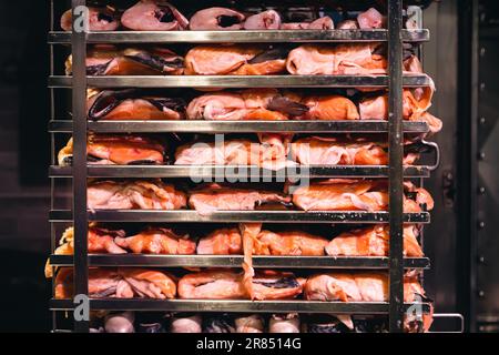 Racks of salmon smoking in a small smoker Stock Photo - Alamy