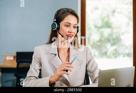Businesswoman with wireless headphones meeting and having conversation Stock Photo