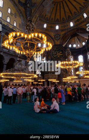 Visitors inside the Hagia Sophia Mosque in Istanbul, Turkey Stock Photo