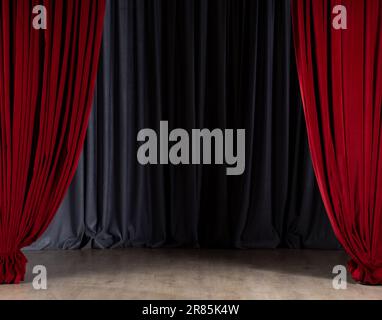 Empty stage with red velvet curtains. Theater stage with gray in-stage curtain and parquet floor Stock Photo
