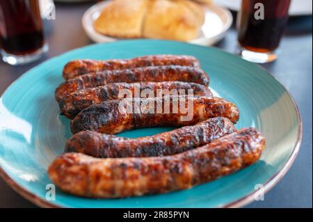 Grilled sausages on a plate. Traditional german bratwurst Stock Photo