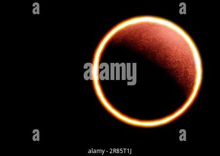 Annular solar eclipse observed from the earth phenomenon in which the moon is between planet earth and star sun forming the ring of fire Stock Photo