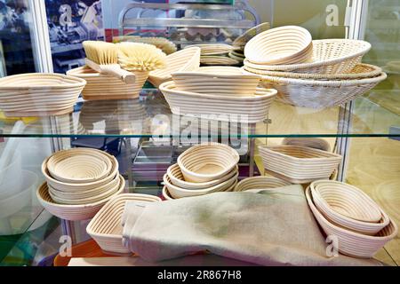 Wooden wicker food utensils in store exhibition Stock Photo