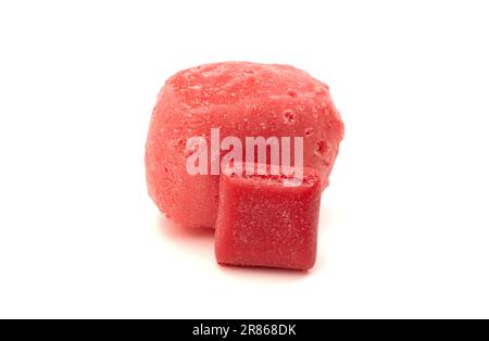 Freeze Dried Cherry Chewy Square Candy and an Original Piece Side by Side Isolated on a White Background Stock Photo