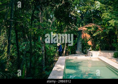 man cleaning next to the pool. High quality photo Stock Photo