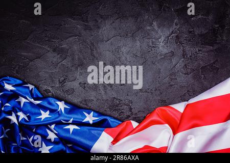 4th of july background. American flag on black stone background. Copy space Stock Photo