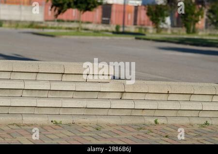 dry stone walls, construction detail of prefabricated walls in gravity concrete blocks, retaining wall in concrete blocks. Stock Photo