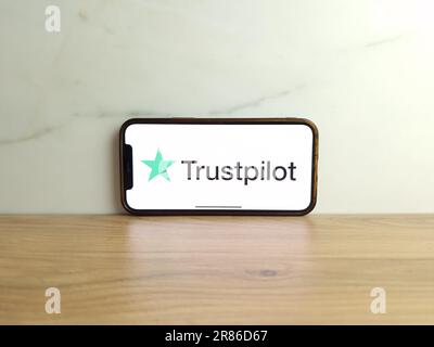 Konskie, Poland - June 17, 2023: Trustpilot reviews website logo displayed on mobile phone screen Stock Photo