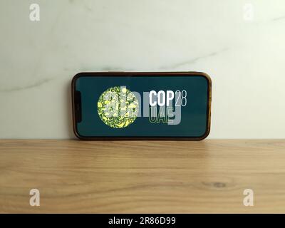 Konskie, Poland - June 17, 2023: COP28 UAE United Nations Climate Change Conference logo displayed on mobile phone screen Stock Photo