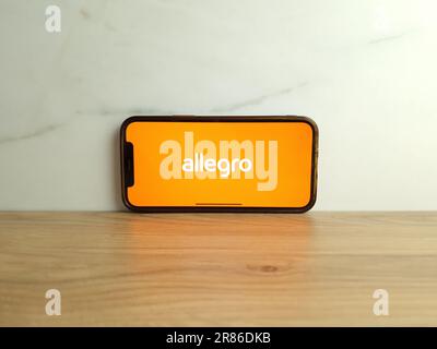 Konskie, Poland - June 17, 2023: Allegro Polish auction website logo displayed on mobile phone screen Stock Photo