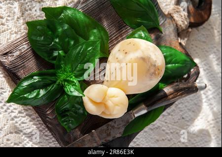 scamorza, Pasta Filata, Italian cheeses collection, smoked scamorza pear shaped cheese from small cheese farm in South Italy made from cow milk. Stock Photo