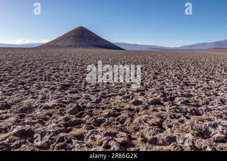 Perfectly shaped Cono de Arita in the Salar de Arizaro in the morning - Exploring the Argentinian highlands called Puna while traveling South America Stock Photo