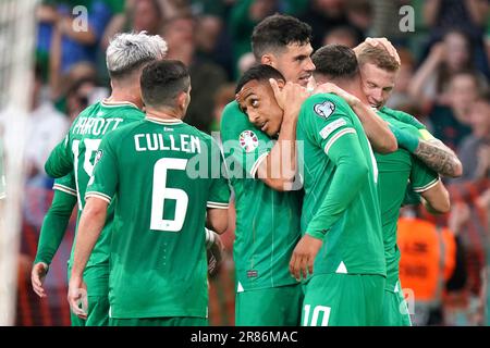 Republic of Ireland's Adam Idah (centre right) celebrates scoring their side's third goal of the game with team-mates during the UEFA Euro 2024 Qualifying Group B match at the Aviva Stadium, Dublin. Picture date: Monday June 19, 2023. Stock Photo