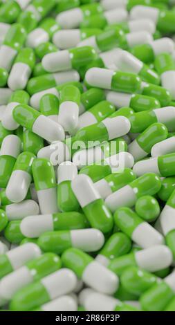 Bunch of green white capsule pills on a white background - Medicine healthcare medicaments - vertical Stock Photo