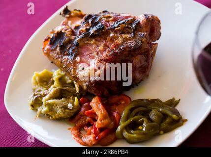 Grilled pork knuckle with vegetables Stock Photo