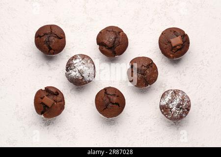 Tasty chocolate cupcakes on light background Stock Photo
