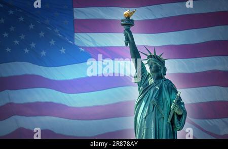 Statue of Liberty against an American Flag symbolizing unity in the United States Stock Photo
