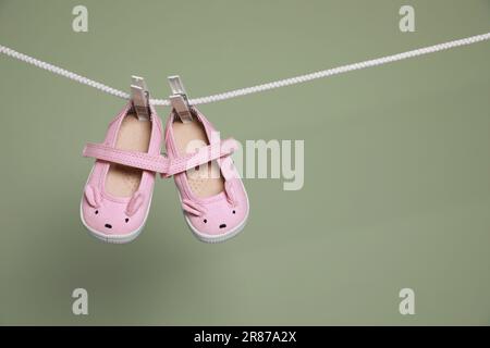 Pair Of Small Baby Socks On Pink Background With Copy Space For Your Warm  Message, Baby Shower, First Newborn Party Background, Copy Space, Cute  Minimal Postcard Stock Photo, Picture and Royalty Free