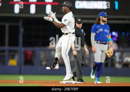 Miami Marlins' Jesus Sanchez, left, is congratulated by first base