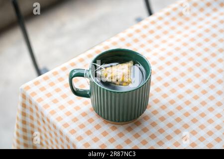 Hot tea in a green cup. High angle view, copy space. Stock Photo