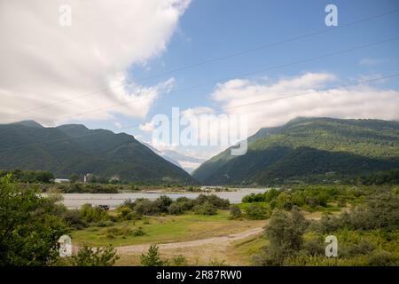 Stone And Spruce Tree On A Grassy Meadow Of The Mountain Ridge. Warm 